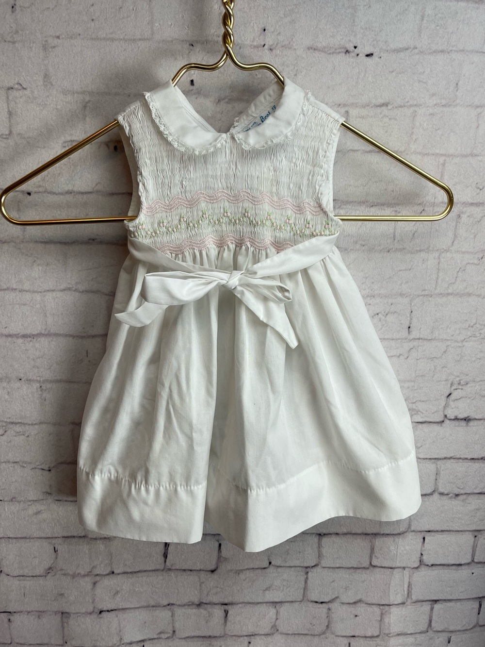 Feltman Bros white wrap baby dress smocked bodice